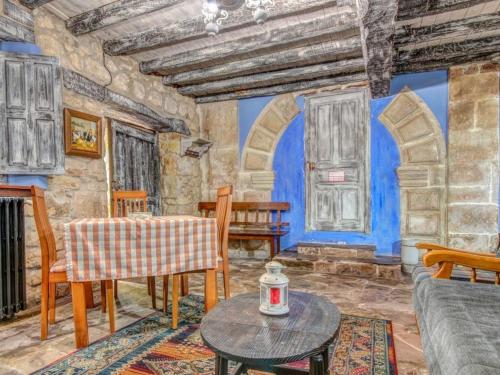 a living room with a painting on the wall at Casona Dos Lagos in Villanueva