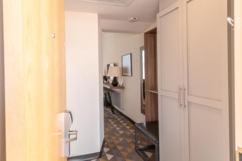 a hallway with a door leading into a room at Holiday Inn Tlaxcala by IHG in Tlaxcala de Xicohténcatl