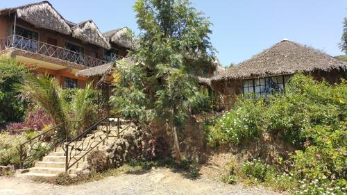 a house with a staircase in front of it at Osoita Lodge in Nairobi