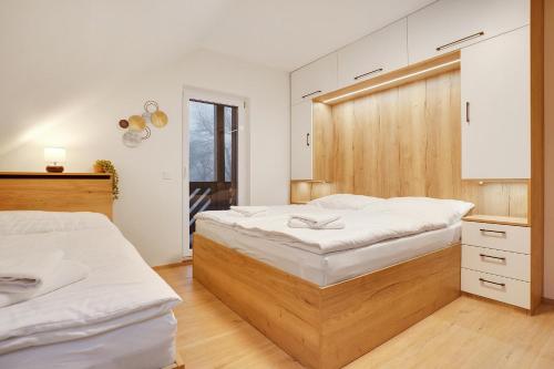 Postel nebo postele na pokoji v ubytování Krušnohorské Stráně
