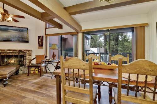 a dining room with a table and a fireplace at 2180-Sunflowers and Cowboys home in Big Bear Lake