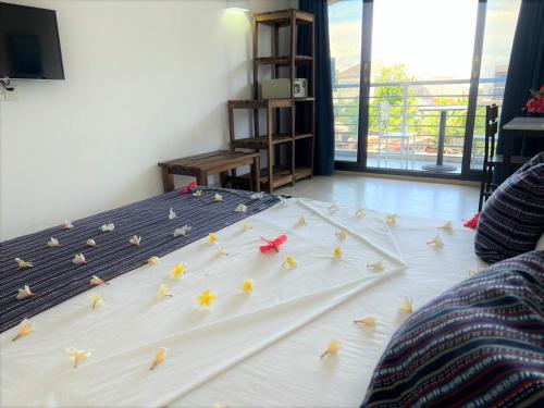 Ένα ή περισσότερα κρεβάτια σε δωμάτιο στο Hôtel Ambatoloaka