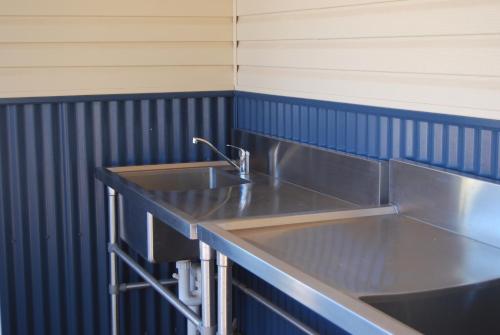 A kitchen or kitchenette at Coral Coast Tourist Park