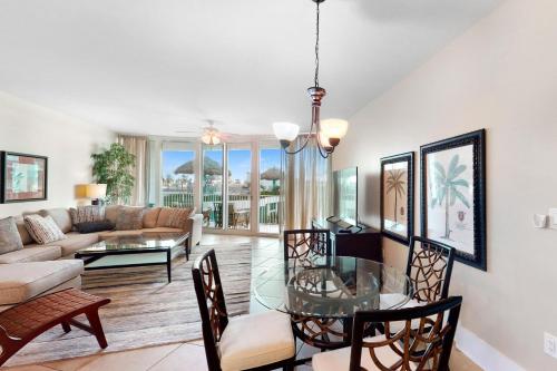 a living room with a couch and a table at Caribe D216 in Orange Beach