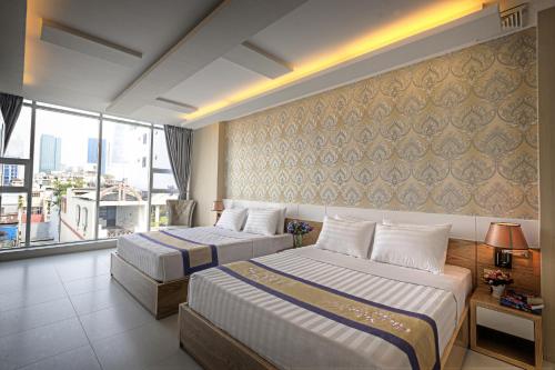 Giường trong phòng chung tại Vân Anh Luxury