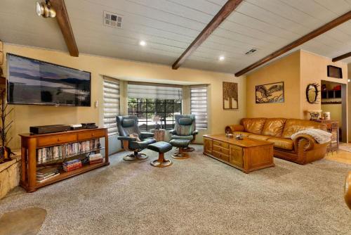 a living room with a couch and two chairs at 2012-Moose Manor home in Big Bear Lake