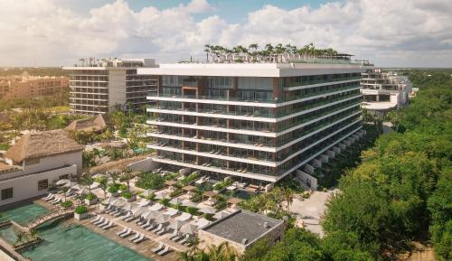 an aerial view of a hotel with umbrellas and a pool at Impression Moxché by Secrets - Adults Only in Playa del Carmen