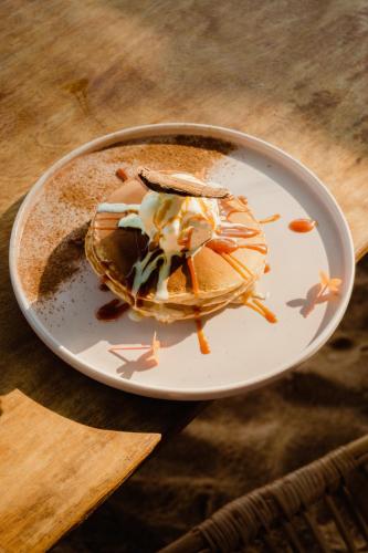 a plate of food on top of a table at Sky Breeze in Unawatuna