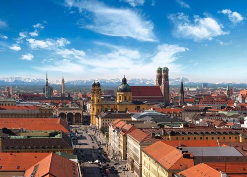 an aerial view of a city with buildings at Holiday Inn Express München Messe by IHG in Feldkirchen