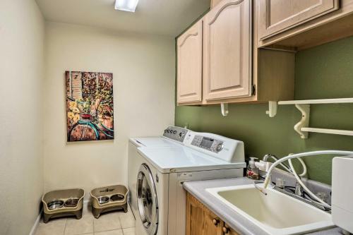 a kitchen with a washing machine and a sink at Littleton Home with Patio - 8 Mi to Red Rocks in Littleton