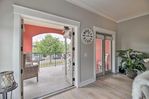 a room with a door and a clock on the wall at Pet-Friendly Villa with Balcony in Bluffton! in Bluffton