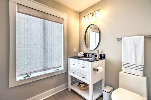 a bathroom with a sink and a mirror and a window at Pet-Friendly Villa with Balcony in Bluffton! in Bluffton