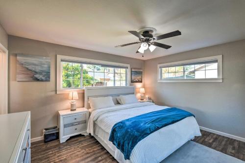 a bedroom with a bed and a ceiling fan at Vibrant Sacramento Home with Yard and Patio! in Freeport