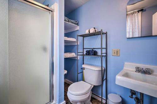 a bathroom with a toilet and a sink and a shower at Downtown Hallowell Retreat with Water Views! in Hallowell