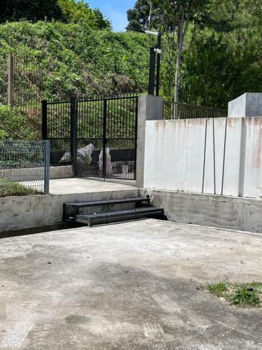 a skate park with a black fence and a ramp at 15PAX 3 BR, Kids Swimming Pool, Pool table, BBQ near Spice ARENA, Airport Penang in Bayan Lepas