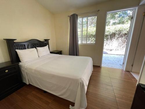 Postel nebo postele na pokoji v ubytování Hotel Real Home
