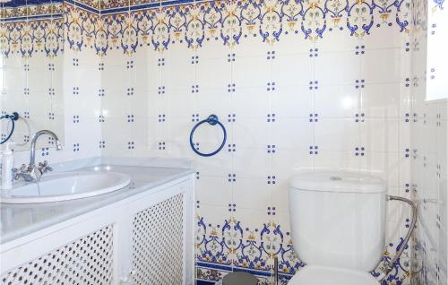 a bathroom with a toilet and a sink at Gorgeous Home In Svaneke With Wifi in Svaneke