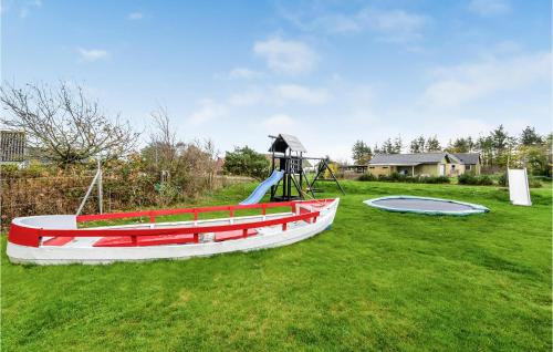 a playground with a slide and a play equipment at 3 Bedroom Beautiful Home In Vemb in Vemb