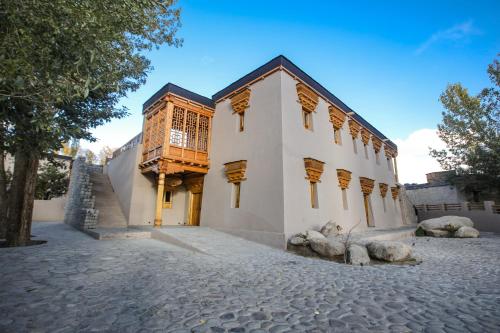 a building with a balcony on the side of it at Dolkhar Resort in Leh