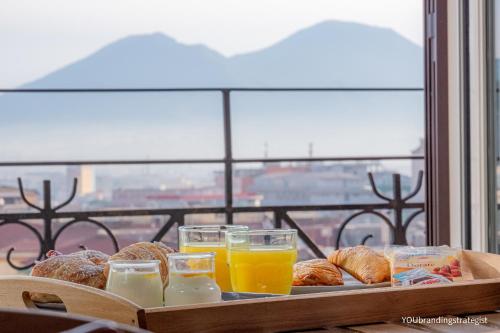 a tray of pastries and glasses of orange juice at La Peonia in Naples