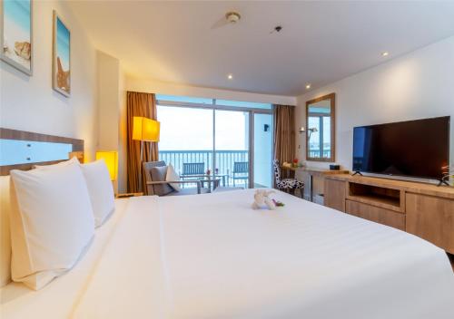 Televisyen dan/atau pusat hiburan di Radisson Resort & Spa Hua Hin
