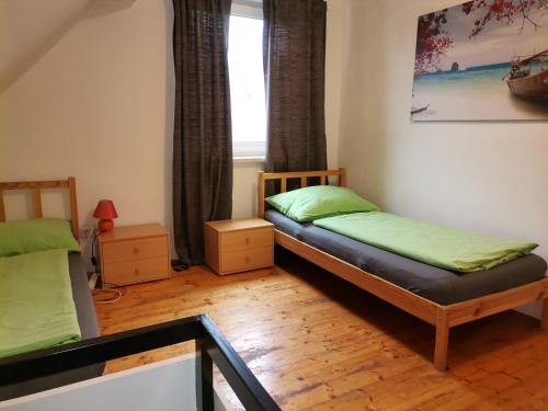 a bedroom with two bunk beds and a window at Pension Prem in Kapfenberg