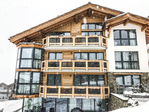 a large wooden house in the snow at Panorama Ski Lodge in Zermatt