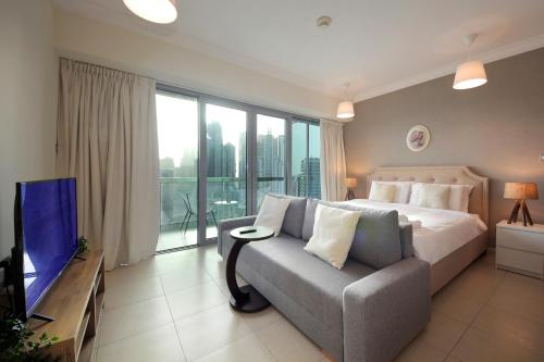 Postel nebo postele na pokoji v ubytování Prime Retreats- Downtown Dubai