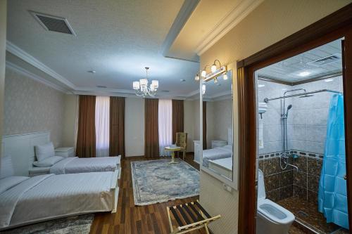 Ένα ή περισσότερα κρεβάτια σε δωμάτιο στο Comfort Hotel Samarkand