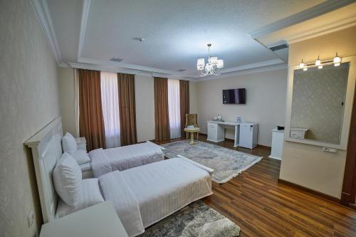 Ένα ή περισσότερα κρεβάτια σε δωμάτιο στο Comfort Hotel Samarkand