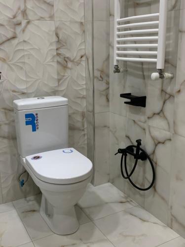 a bathroom with a toilet and a shower at City Central Apartment in Yerevan