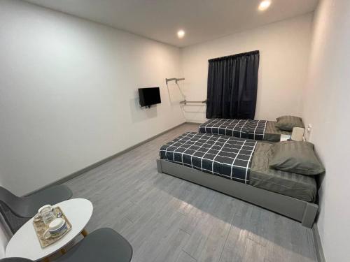 Krevet ili kreveti u jedinici u objektu Alor Lanchang Roomstay