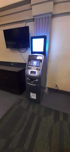 an atm machine with a screen in a room at Americas Best Value Inn Phenix City in Phenix City
