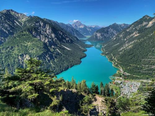 a view of a lake in the mountains at Chalet Panorama Tirol in Hofen