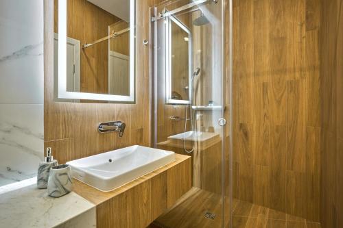 Koupelna v ubytování Olimp Hotel