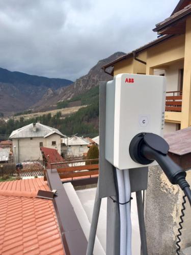 a air conditioner on the roof of a house at Kris Guest House in Devin