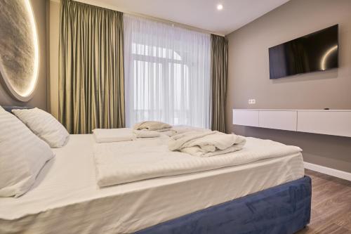 Postel nebo postele na pokoji v ubytování Olimp Hotel