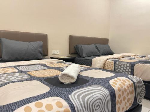 Postel nebo postele na pokoji v ubytování Ze Xiang Hotel - Desa Jaya Ikea Self Check in