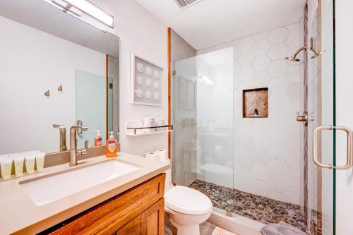 a bathroom with a toilet and a sink and a shower at Juanita by the Bay in Incline Village