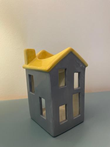 a toy house sitting on top of a table at Amazing Getaways - The Place for You with Free Parking in Aberdeen