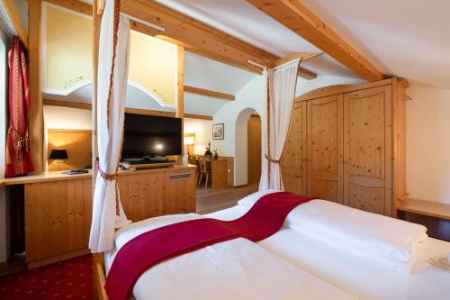 Una cama o camas en una habitación de Hotel Florian
