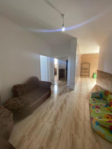 a living room with a couch and a bed in it at Apartment in madba in Madaba