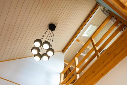 a chandelier hanging from the ceiling in a room at IZA近江舞子 in Minami-komatsu