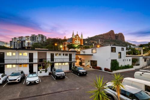 a view of a building with cars parked in a parking lot at The Robert Towns in Townsville