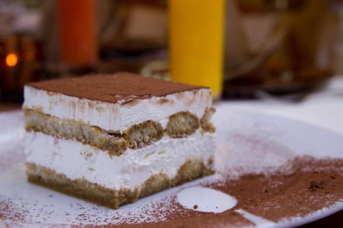 a piece of cake sitting on top of a plate at Vila Preciosa in Alba Iulia