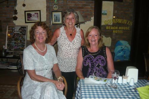 three women posing for a picture at a table at Beach House Hotel in Side