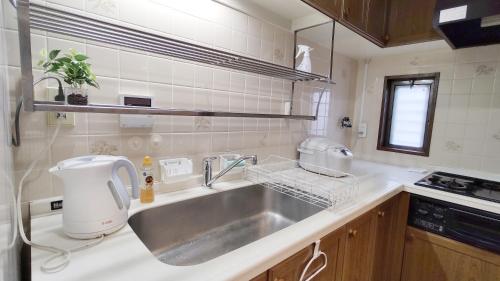 Kuchyň nebo kuchyňský kout v ubytování Kyoan Shion