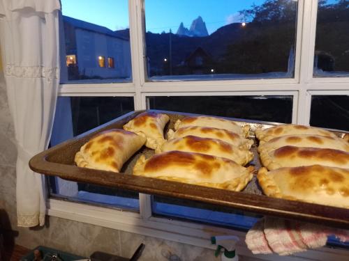 a tray of bread in front of a window at Hotel Lago del Desierto in El Chalten