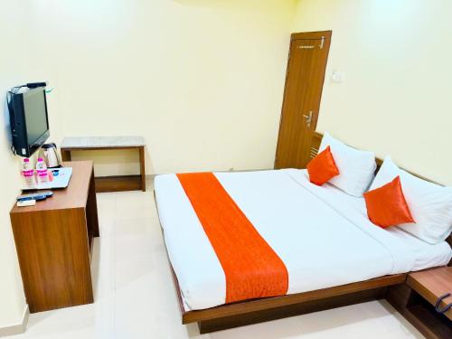 Cama o camas de una habitación en SAI SRUSHTI by NEEM SQUARE