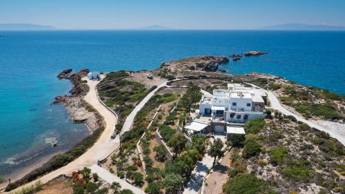 an aerial view of a house on an island in the ocean at Martineli Residence - A Beachfront Estate in Drios
